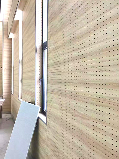 Perforated sound-absorbing board (11)